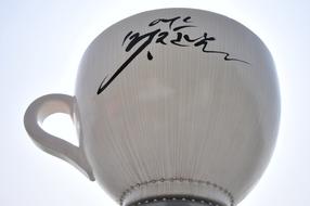 teacup with a pattern on a blue sky background