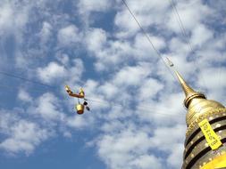 golden roof with blue sky clouds