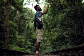 tourist with a camera in the jungle