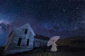 ghost girl with umbrella near abandoned house