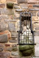 lantern with rocks against the wall