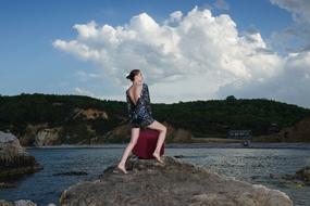 beautiful girl on a rock