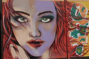 graffiti in the form of a portrait of a girl with red hair