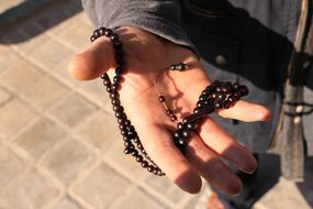 black beads on male palm