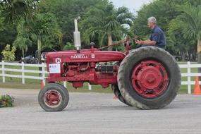 red tractor with a man