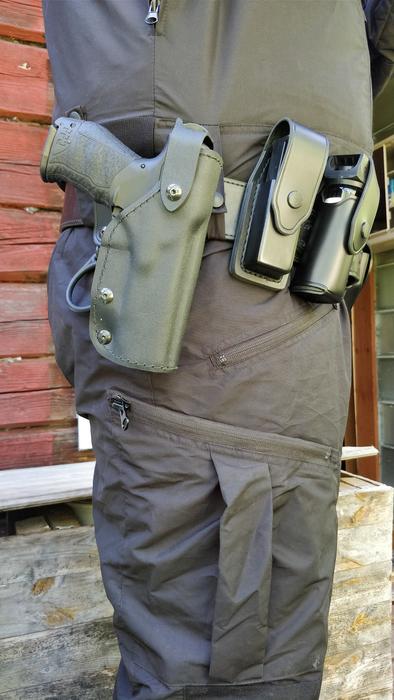 Guard wearing pistol and other equipment on the belt