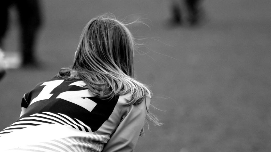 Rugby, bended Girl with number 12 on uniform