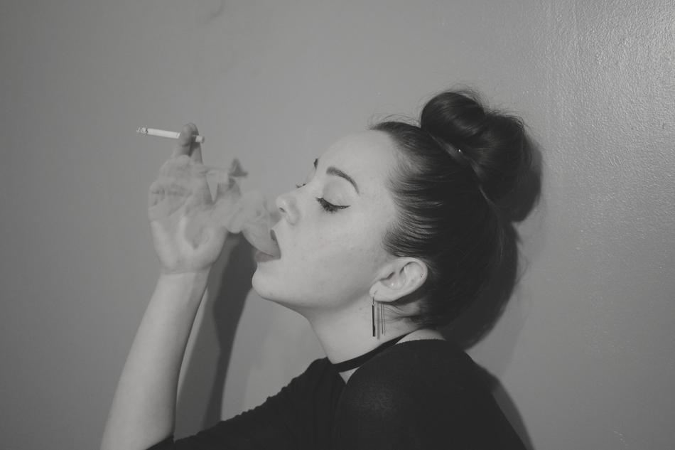 monochrome photo of a girl with a cigarette