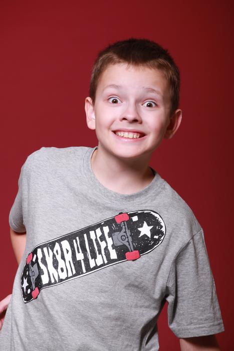 photo of a boy on a red background