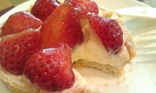 Sweet strawberries on a creamy dessert