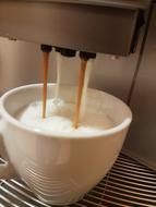 frothy coffee in a mug