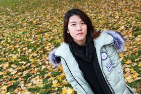 portrait of asian Girl in winter coat at fall