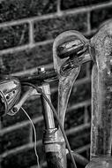 Black and white photo with close-up of the bike in icicle