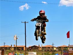Boy jumping on Motorcycle