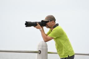 photographer with a camera near the parapet