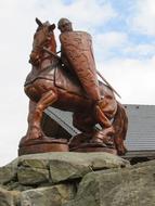 warrior, armored horse rider, wooden sculpture outdoor in Saxony