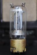 Close-up of the shiny vacuum tube, at blurred background
