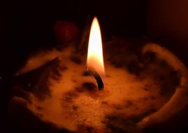 Flame Candle Burnt close-up in the dark