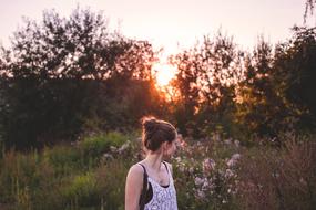 girl looking away at sunset