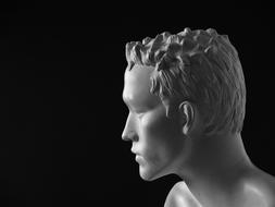 Profile portrait of the shiny figure of a man, at black background