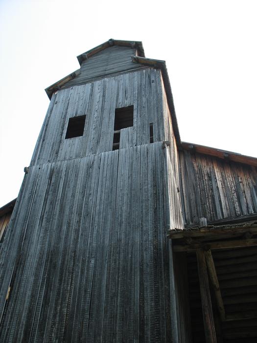 aged weathered wooden tower, rear view
