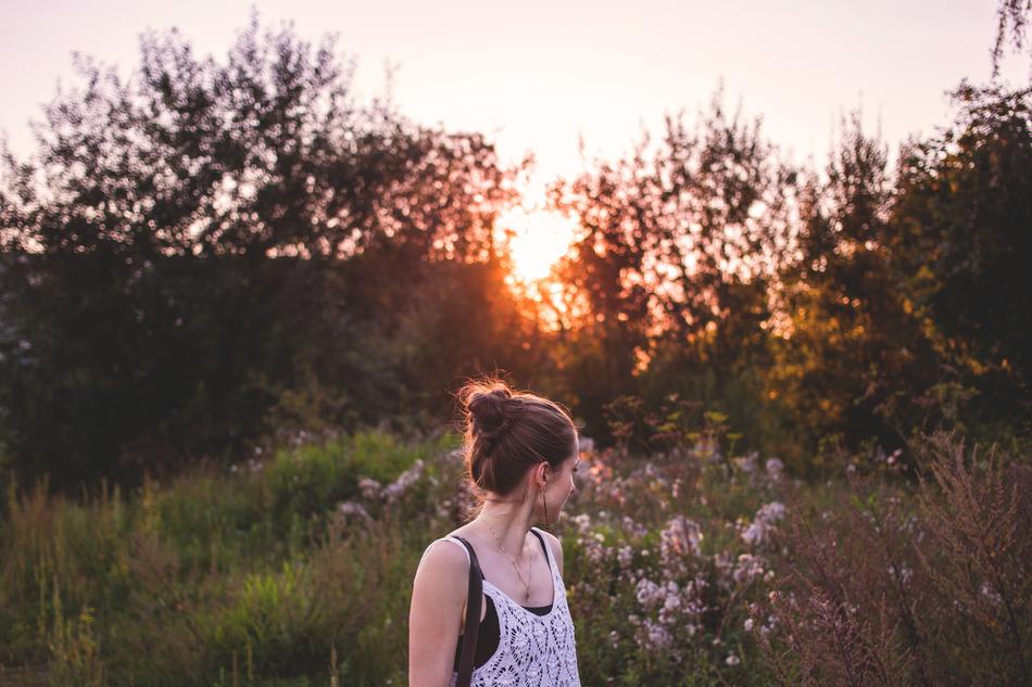 girl looking away at sunset