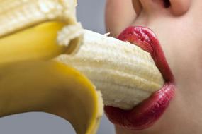 girl eating a banana