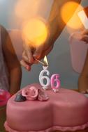 candles on a pink cake