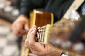 guitar in male hands close up