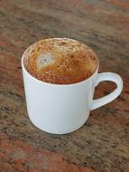 sweet hot coffee in a white mug