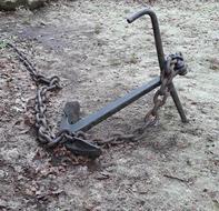 iron anchor in the mud