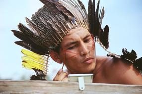 Portrait of the KaxinawÃ¡ man with feathers, in Acre, Brazil