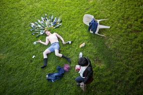 Man Passed Out Drinking at grass