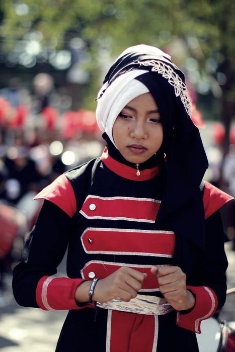 girl in hijab at the carnival on a blurred background