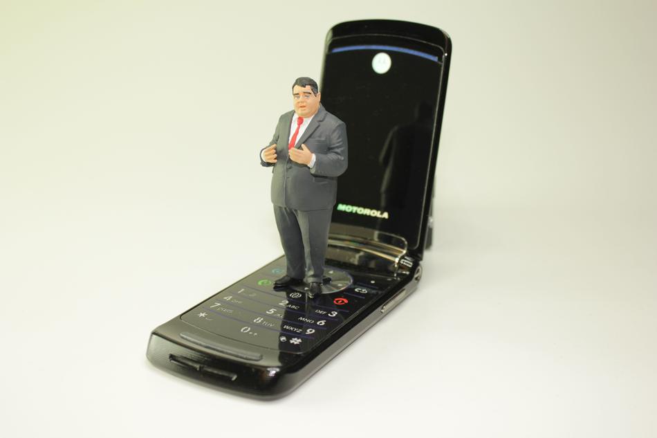 figure of politician Sigmar Gabriel on flip phone