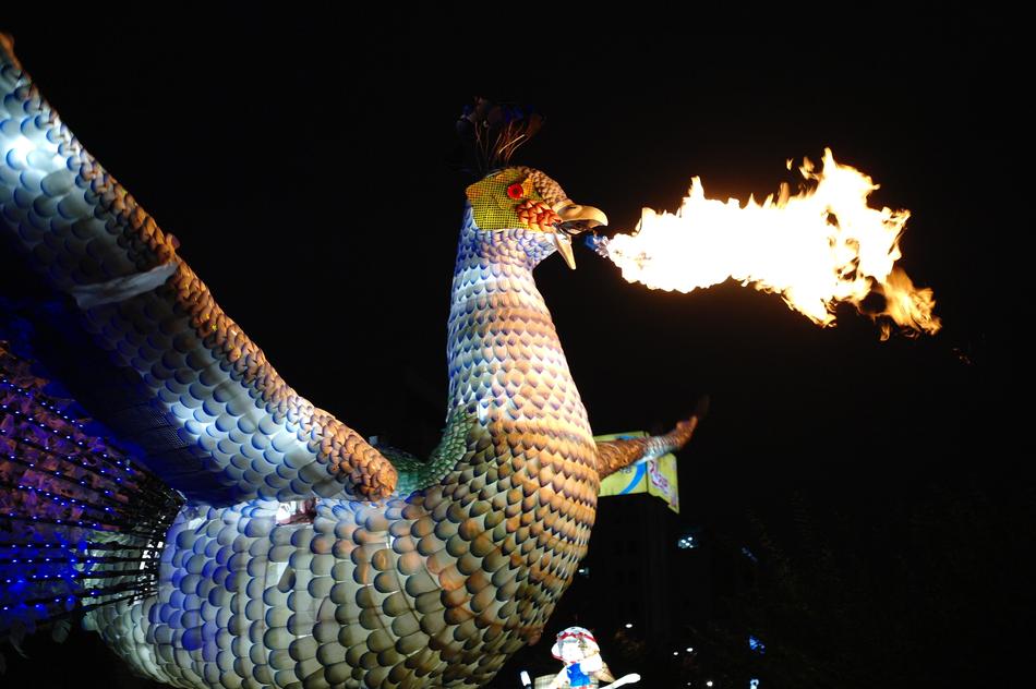 flame breathing bird at night, figure on asian festival