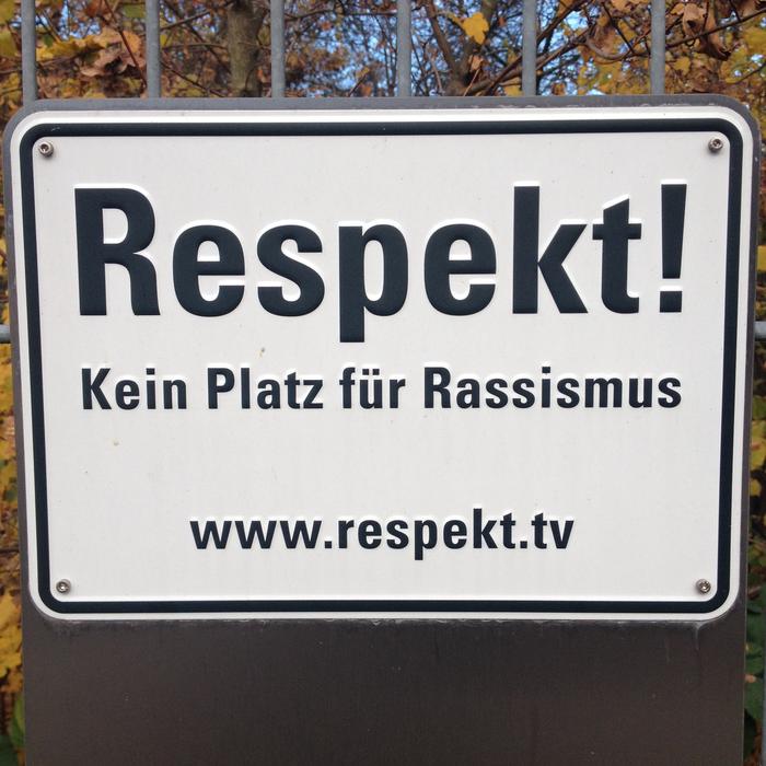 Respect, street sign on gate
