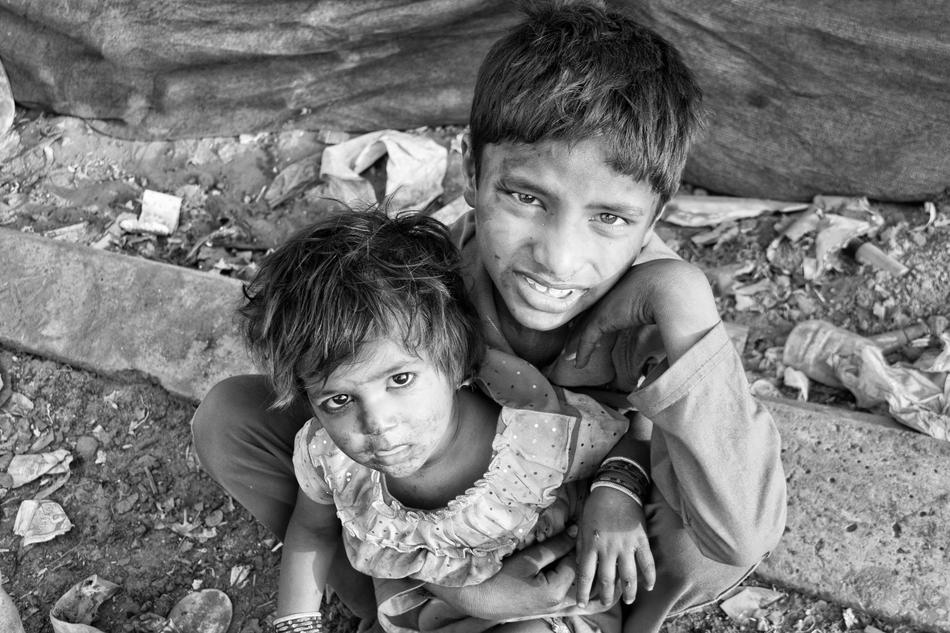 Black and white photo with portrait of the children in slums