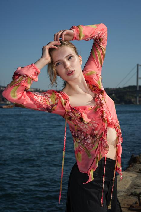 an unusual girl in a pink suit