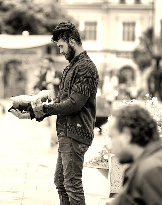 Man with Pigeons on street