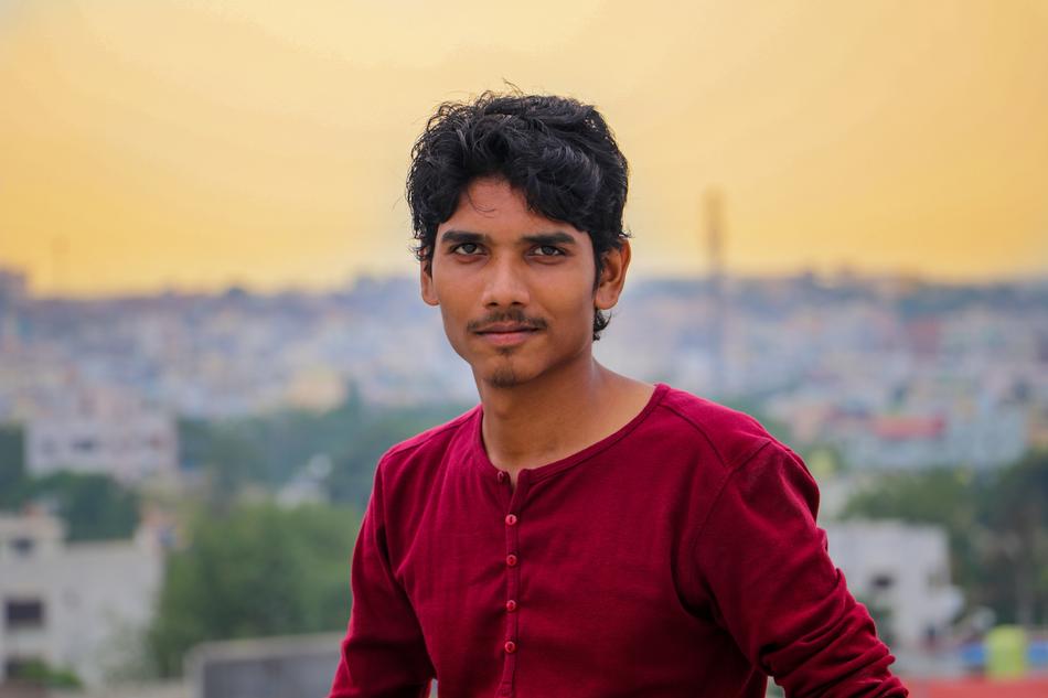 Portrait of the man with moustache, at background with the cityscape