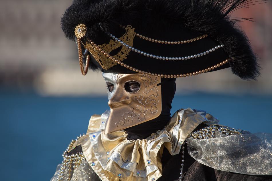 a man in a suit at the carnival in Venice