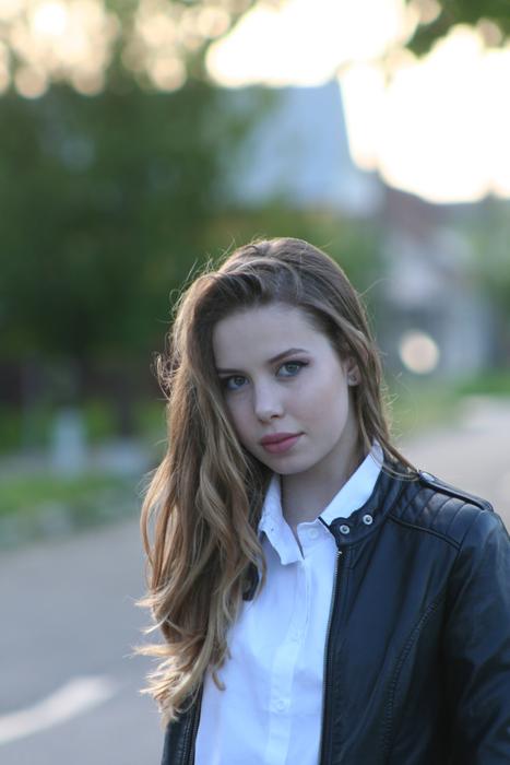 Portrait of Girl with Long Hair on street