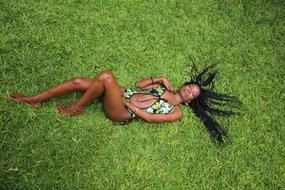 Girl in bikini on Lawn Nature in Summer
