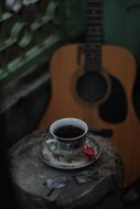 coffee with a guitar in the background