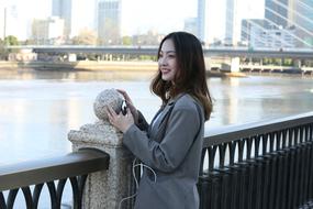 Asian woman standing water