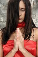 girl praying in red