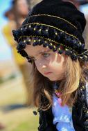 Portrait of girl in black hat Outdoors