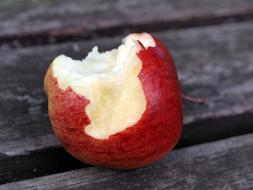 bitten apple on the table