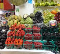 market with ripe berries and fruits
